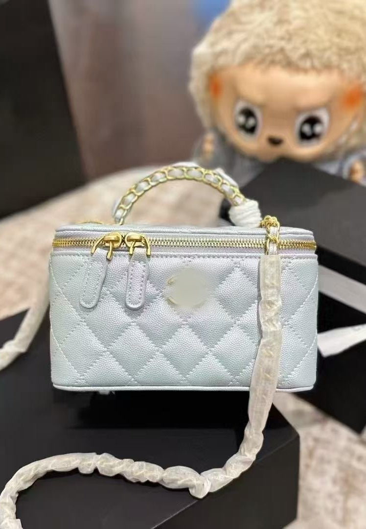 SUNVES CC VANITY BAG in Light blue, quilted vanity case with a top handle and chain strap